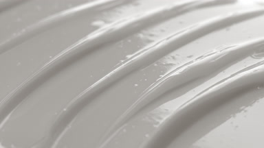 Macro shot of white skincare cream with moving light source