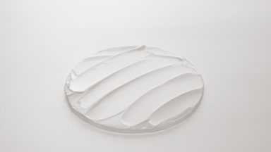 White anti-wrinkle cream with aloe vera extract on watch glass