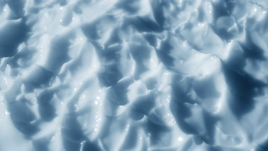 Macro shot of blue lifting cream surface with blue tansy oil