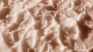 Side view macro of beige lifting cream with collagen surface