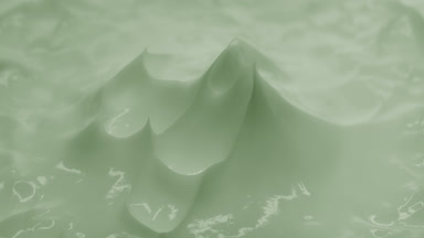 Macro of green eye cream with green tea oil peak in the shadow