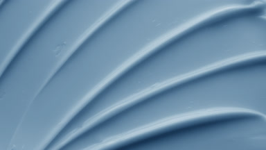 Crane macro shot of blue anti-aging cream