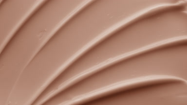 Crane macro shot of beige anti-aging cream with retinol