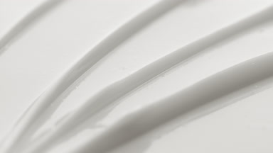 Macro turntable shot of white nutrition cream furrow texture