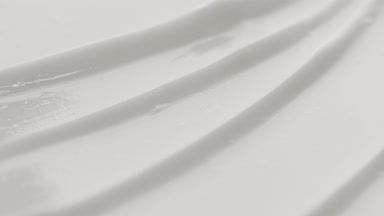 White nourishing cream furrow texture with a reflection of light