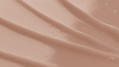 Beige body care cream furrow texture with a reflection of light
