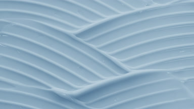 Macro crane shot of blue day cream wave texture