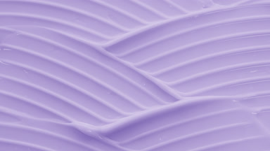 Macro shot of violet day cream with niacinamide wave texture