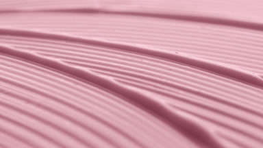 Macro jib shot of pink night cream wave texture