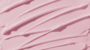 Pink anti-aging cream furrow texture appears from the shadow