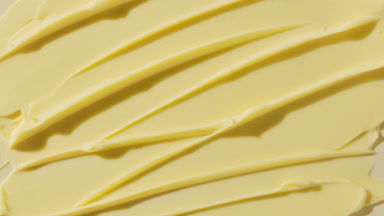 Yellow anti-aging cream furrow texture appears from the shadow