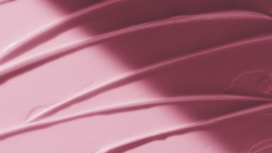 Pink anti-acne cream furrow texture appears from the shadow