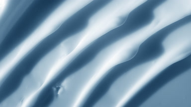 Macro shot of blue night cream with moving light source
