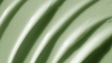 Macro texture of green anti-aging cream with green tea extract
