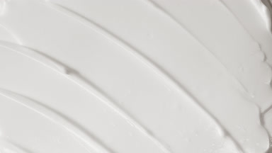 Top view macro turntable shot of white day cream