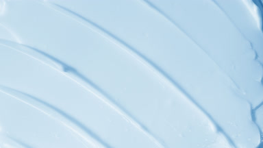 Top view macro shot of blue day cream with cornflower extract
