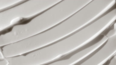 Top view macro turntable shot of white body care cream