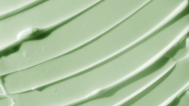 Top view macro of green body care cream with avocado extract