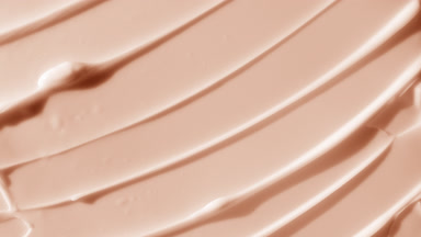 Macro shot of beige body care cream with shea and mango butter