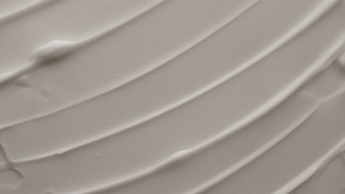 Top view macro shot of white moisturizing cream in the shadow