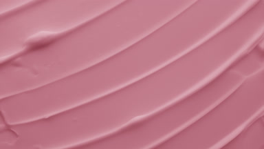 Pink moisturizing cream with pomegranate extract in the shadow