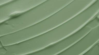 Macro of moisturizing cream with green tea extract in the shadow