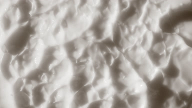 Top view macro shot of white nourishing cream surface