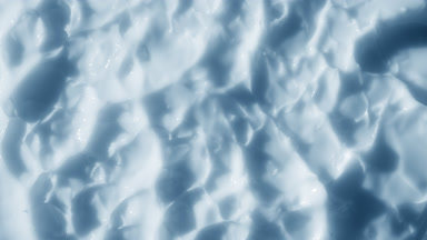 Top view macro shot of blue nourishing cream surface