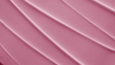 Top view macro shot of pink hydrating cream furrow texture