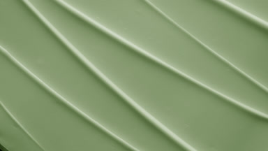 Top view macro shot of green hydrating cream furrow texture
