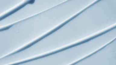 Top view macro turntable shot of blue day cream wave texture