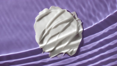 White cream smears on purple background under rippling water