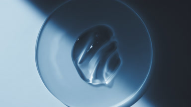 Gel smears on watch glass appear from shadow on blue background