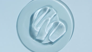 Gel smears on watch glass appear from shadow on blue background