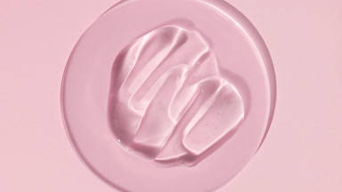 Gel smears on watch glass appear from shadow on pink background