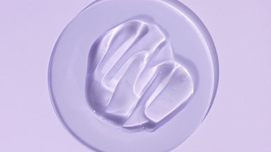 Gel smears on glass appear from shadow on purple background