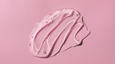 Colorless gel smears appear from shadow on pale pink background