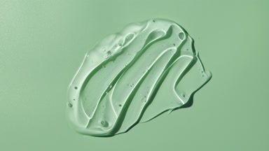 Colorless gel smears appear from the shadow on green background