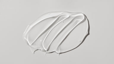 Colorless gel smears appear from the shadow on white background