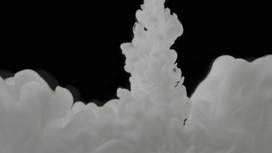 Satisfying shot of white ink fills the space on black background