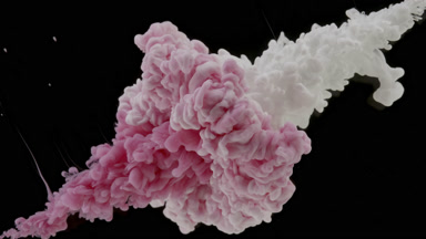 Pink and white inks injected in water mixing on black background