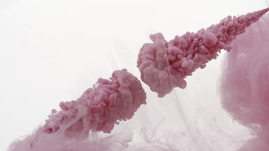 Pink ink injected in water with pink stain from two corners