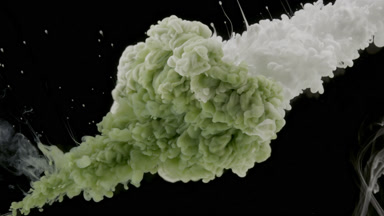 Green and white inks injected in water with stain from corners