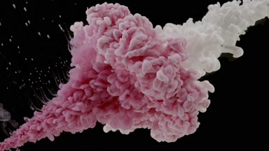Pink and white inks being injected in water from corners mixing