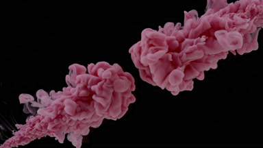 Pink ink injected in water from two corners on black background