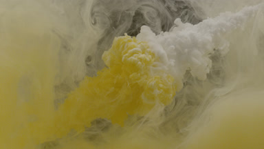 Yellow and white inks injected in water with yellow stain mixing