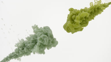 Dark and light green inks injected in water from corners mixing