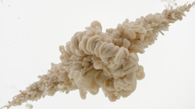 Beige ink is injected in water from corners on white background