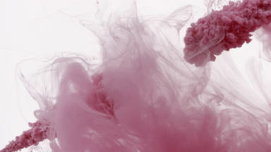 Pink ink is injected in water with pink stain filling the space