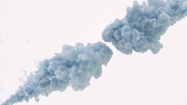 Blue ink injected in water from two corners on white background